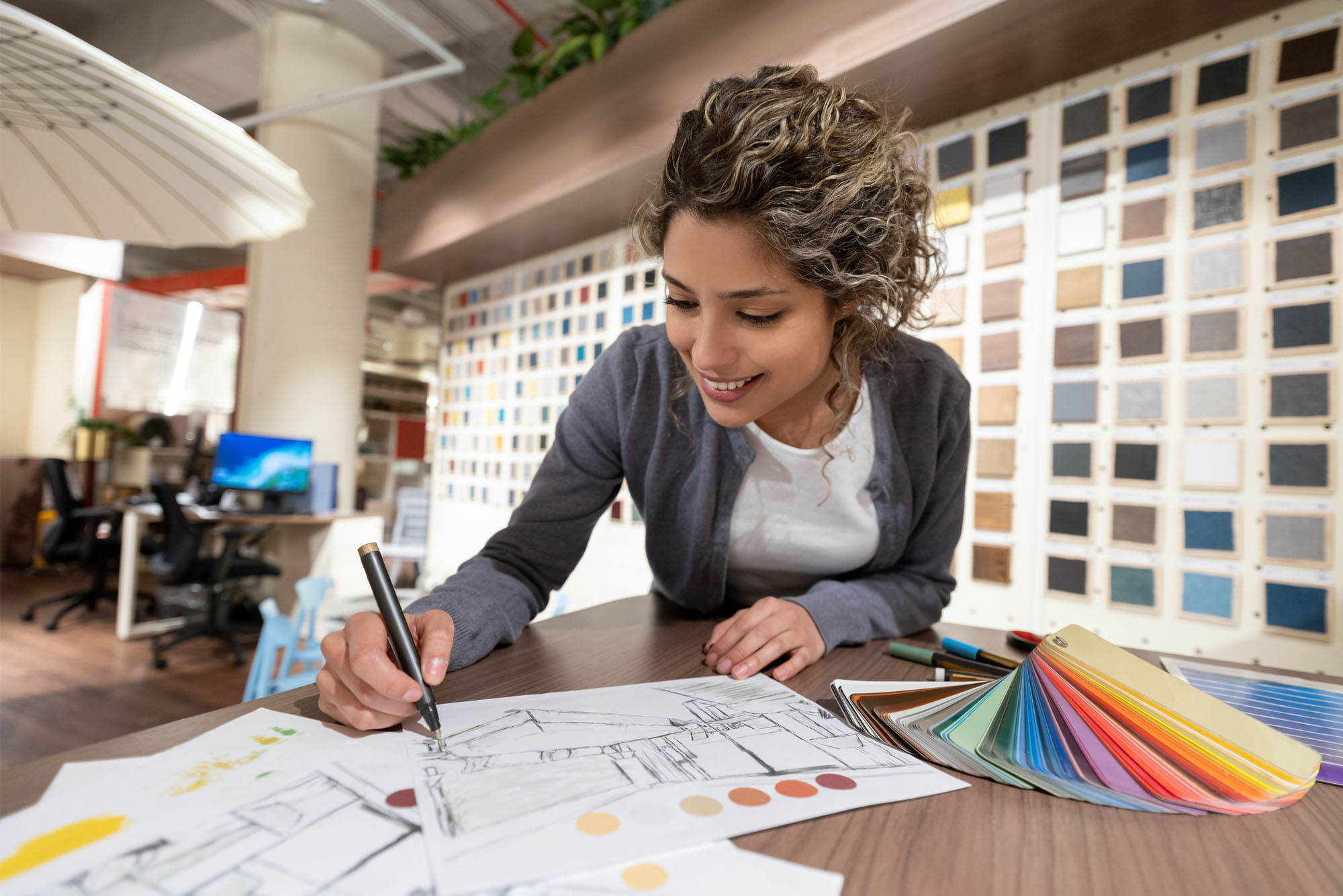 Interior designer drawing sketches while shopping at a furniture store